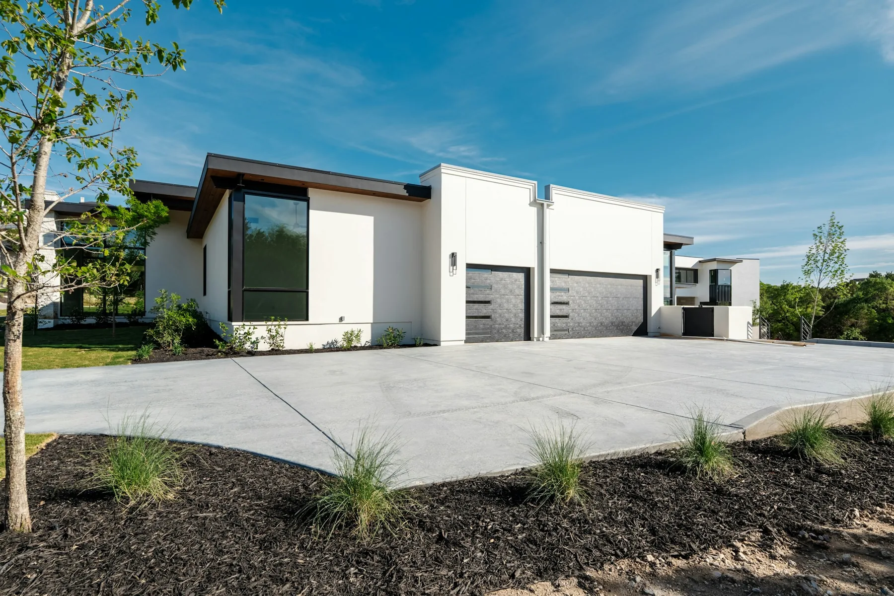 Modern home with a finished concrete driveway