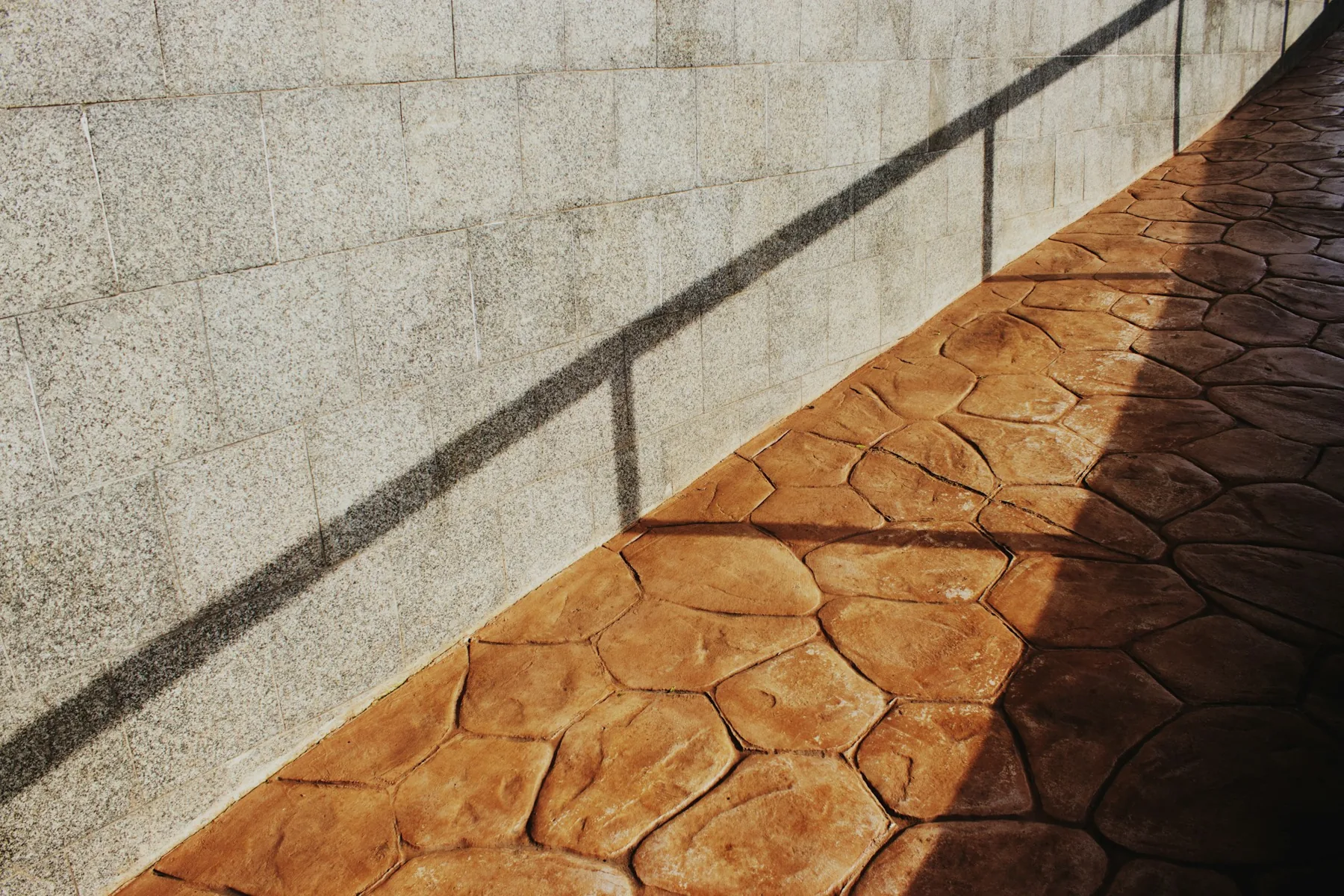 Stamped concrete walkway in a flagstone pattern